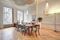The house has herringbone floors, ornate wood details, and tromp l'oeil painted ceilings.