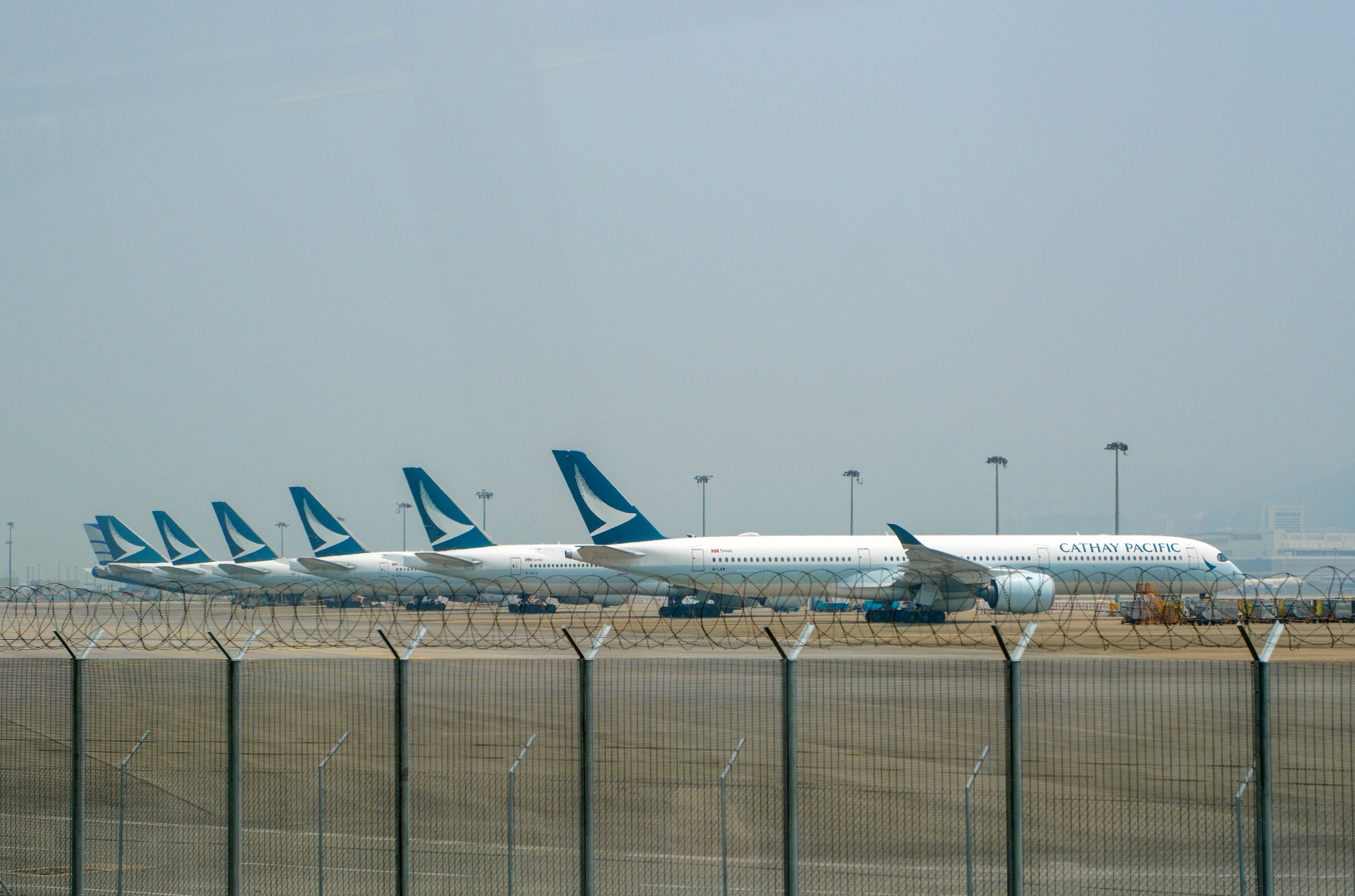 Airbus SE A350 aircraft operated by Cathay Pacific Airways Ltd. on the tarmac at Hong Kong International Airport.