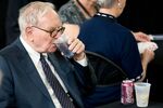 Warren Buffett, chairman of Berkshire Hathaway drinks a Cherry Coke during the Berkshire's 2009 shareholder meeting