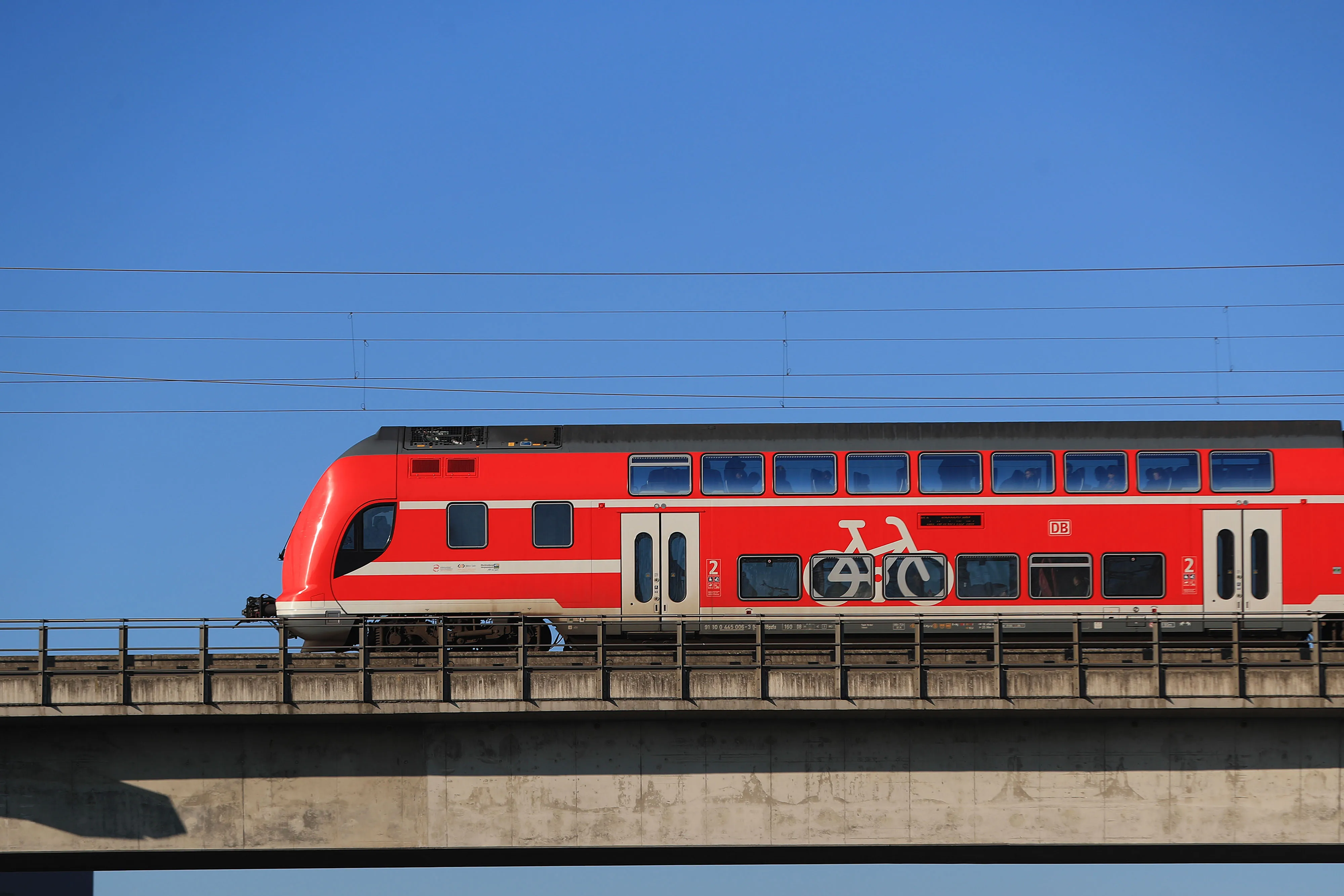 A Regio regional passenger train operated by Deutsche Bahn AG travels on a bridge in Berlin.&nbsp;