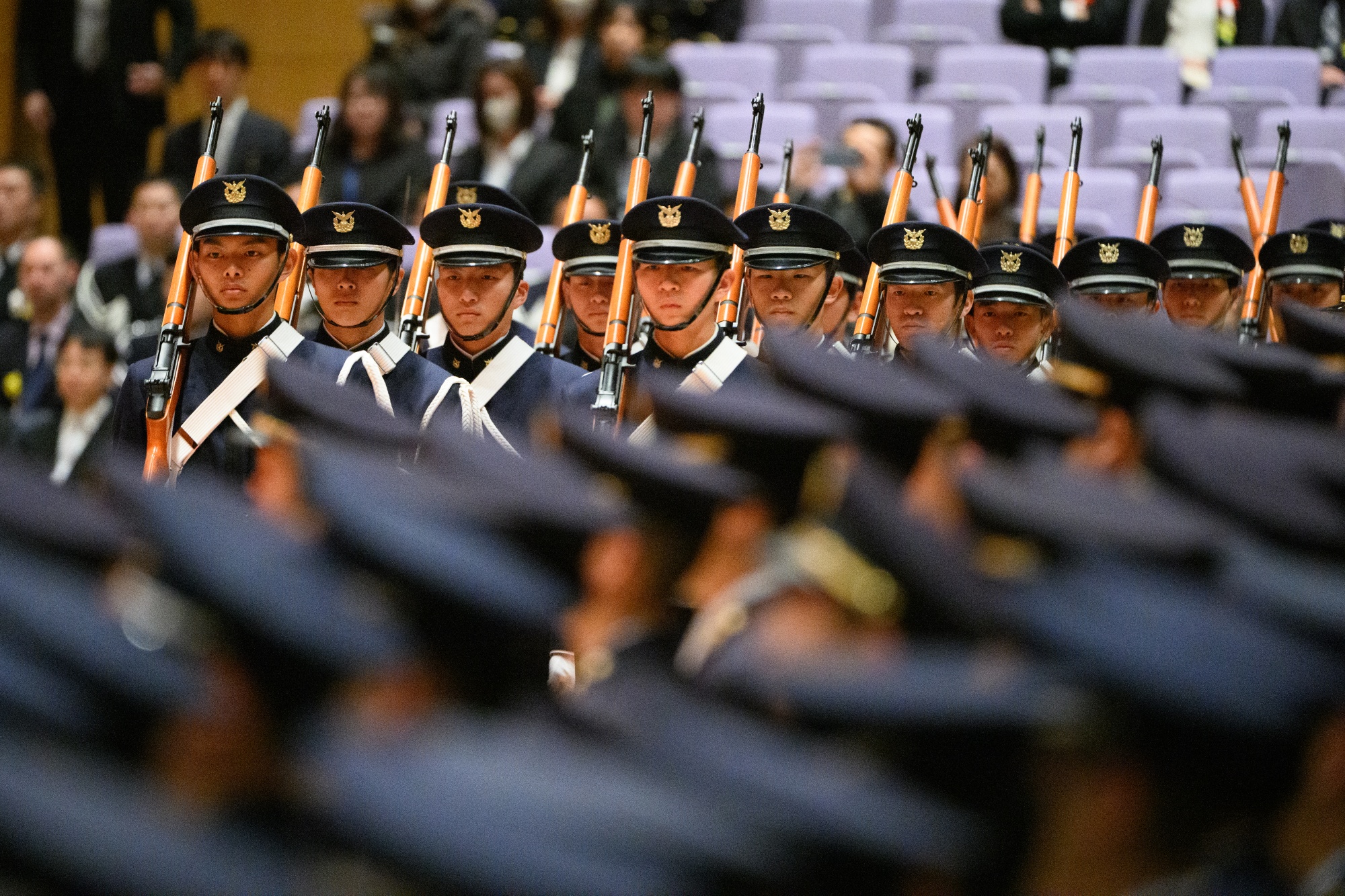 Graduates parade following the Japan's National Defense Academy's graduation ceremony in Yokosuka, Kanagawa Prefecture, Japan, on Saturday, March 14, 2026. Buoyed by the largest electoral mandate in the country's history, Japanese Prime Minister Sanae Takaichi has the political and procedural leverage to pursue sweeping change, including creating an intelligence agency modeled on the CIA, enacting anti-espionage legislation and increasing defense spending aimed at building one of the world's most advanced militaries. Photographer: Akio Kon/Bloomberg 