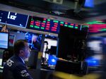 A trader works on the floor of the New York Stock Exchange.
