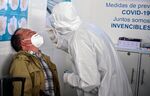 A passenger is tested for Covid-19 at Benito Juarez international airport in Mexico City, on Jan. 8.