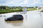 Floodwaters cover a road in Aigues-Vives, France, on Sept. 14.