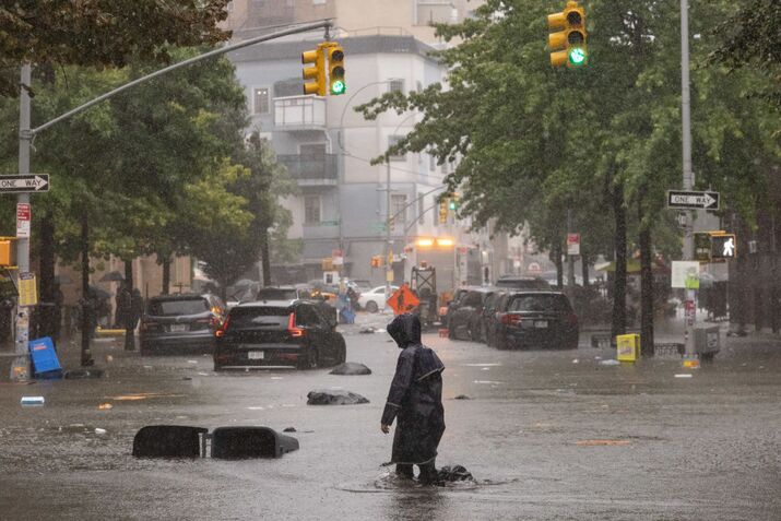  New York,  NY - September 29:

A person walks on a flooded str