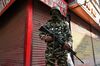 A paramilitary soldier stands guard at a street in Srinagar on Aug. 5.