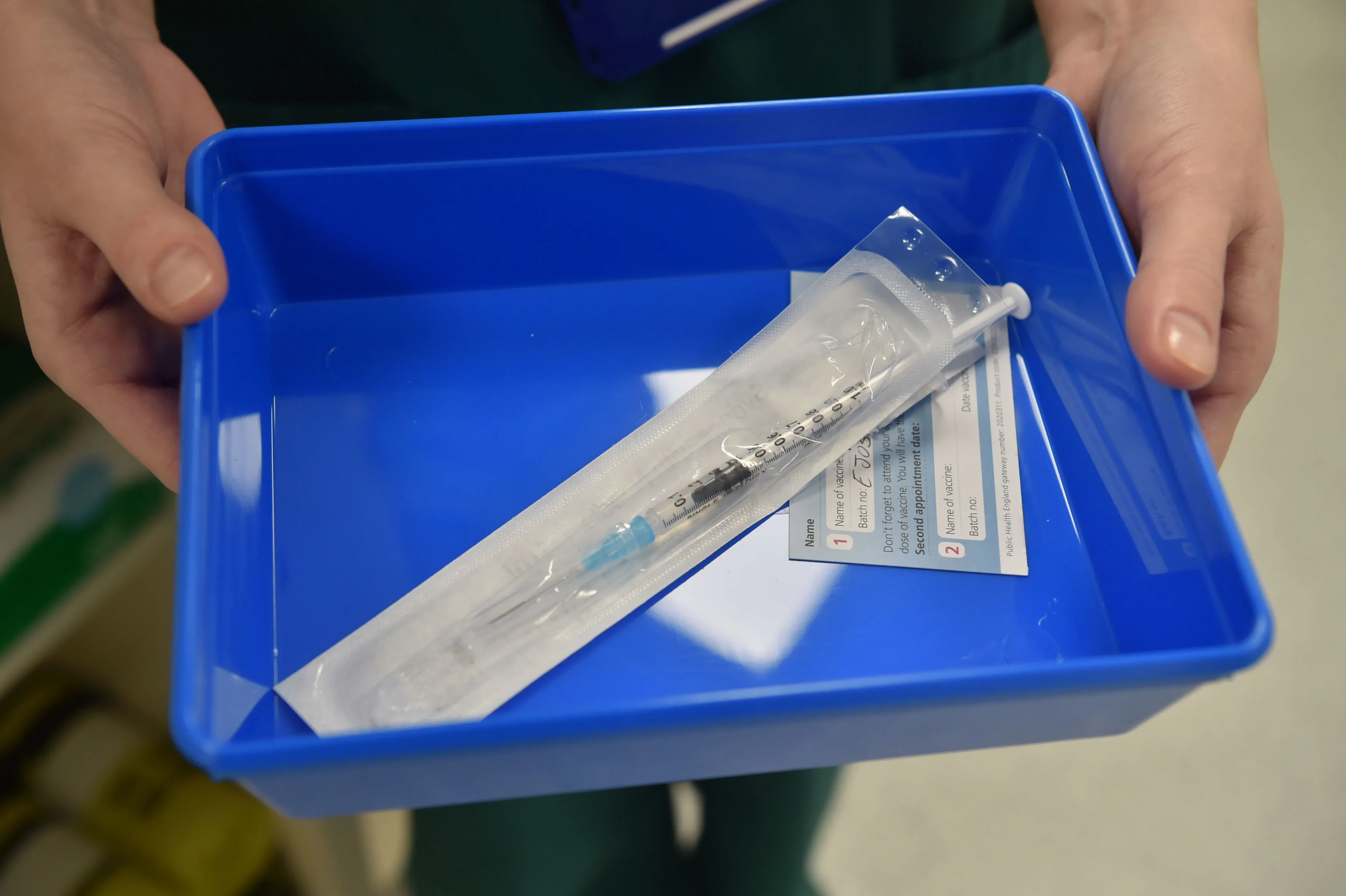 A nurse prepares to administer the Covid-19 vaccine at a vaccination centre in Cardiff, U.K.