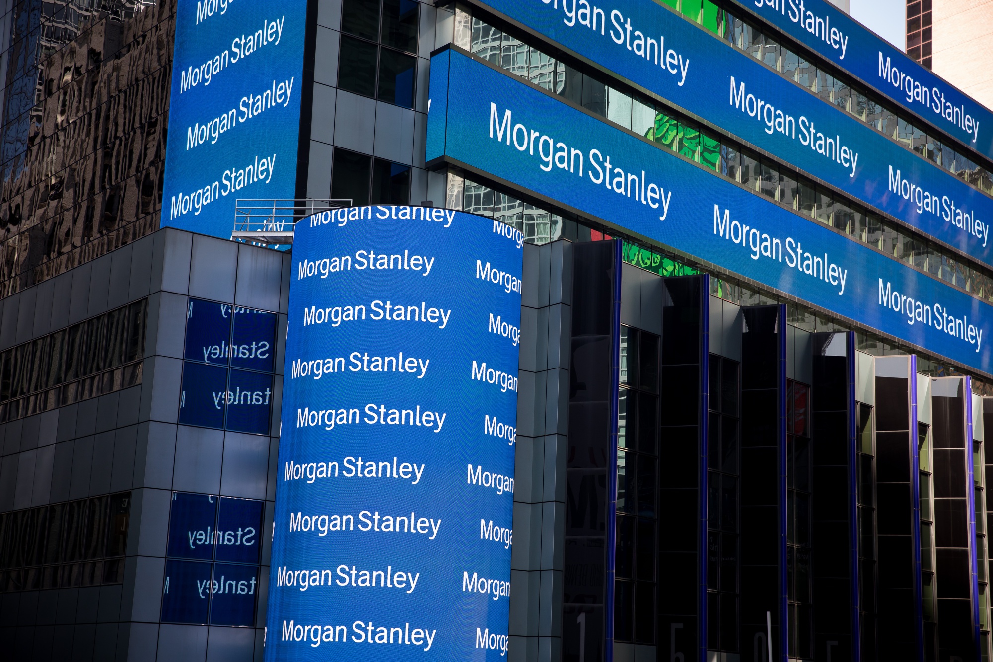 Monitors display signage outside of Morgan Stanley global headquarters.