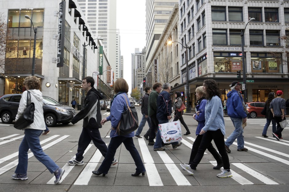 Shoppers walk in downtown Seattle.