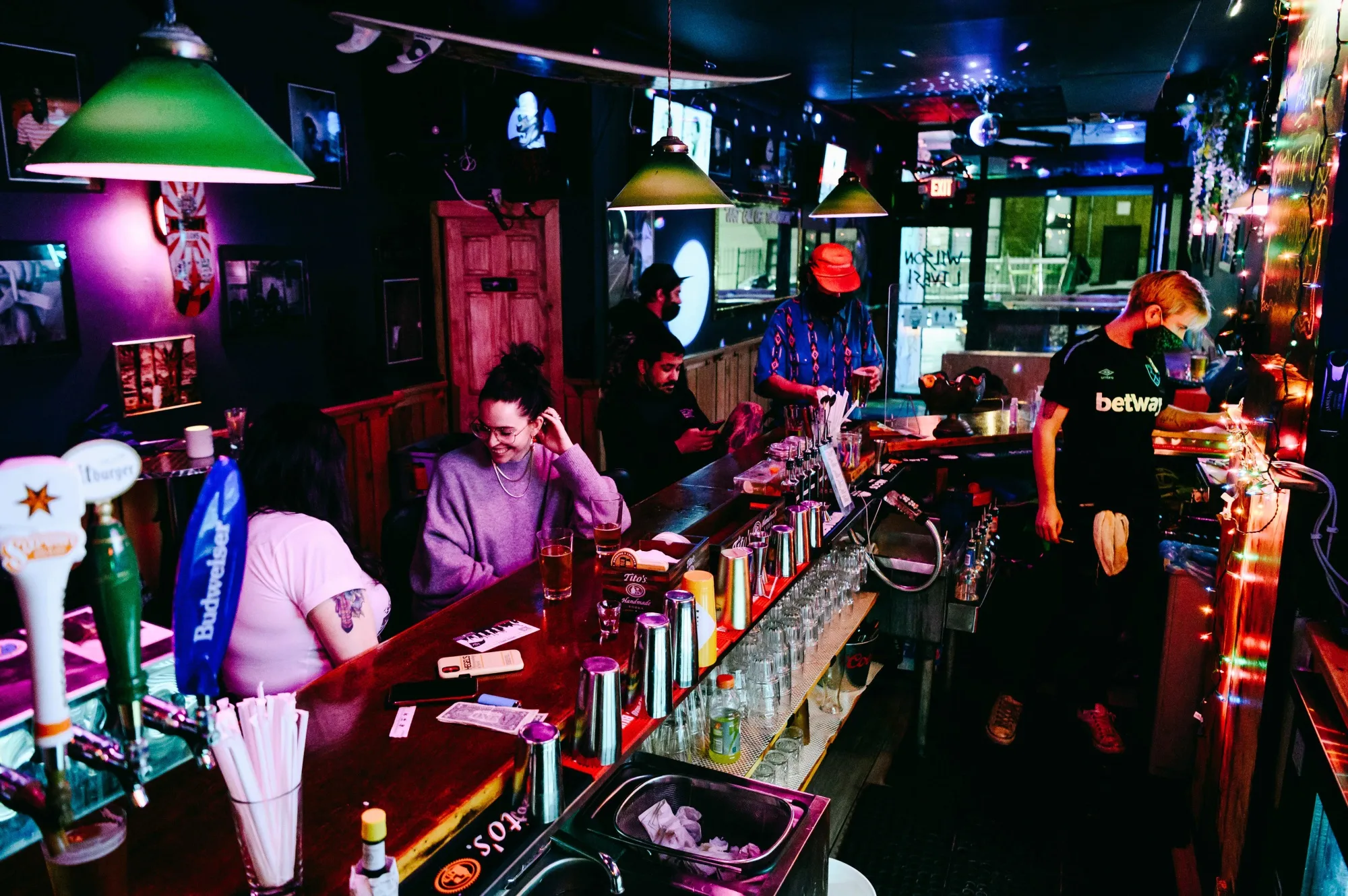 Customers sit at the bar at Wilson Lives! in the Brooklyn borough of New York,&nbsp;on&nbsp;May 3, 2021.&nbsp;