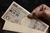 Japanese 10,000 yen banknotes are arranged for a photograph in Kawasaki, Kanagawa Prefecture, Japan, on Tuesday, July 9, 2013. Economists are ditching forecasts for the Bank of Japan to further expand its record easing this year amid signs that a recovering economy may spur inflation.