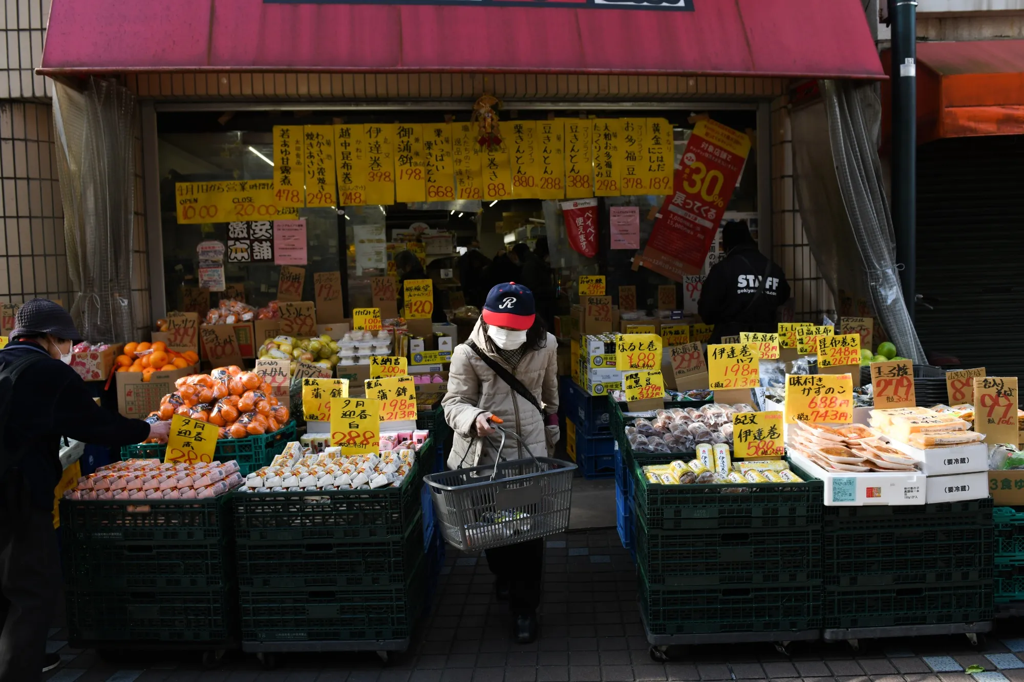 Customers shop at a grocery store in Tokyo, Japan.