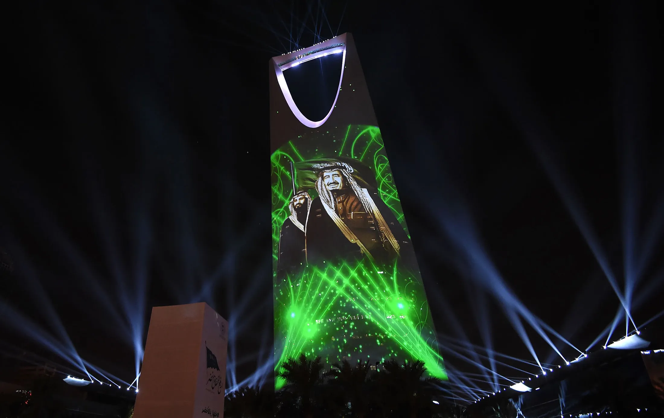 A projection depicts a portrait of King Salman bin Abdulaziz al-Saud and Crown Prince Mohammed bin Salman during an event in Riyadh commemorating the anniversary of the founding of the kingdom.

