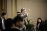 Zhou Xiaochuan, governor of the People's Bank of China (PBOC), waves during a news conference on the sidelines of the fourth session of the 12th National People's Congress (NPC) in Beijing, China, on Saturday, March 12,.
