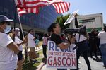 Supporters of a campaign to recall George Gascon outside the Los Angeles County Registrar of Voters in Norwalk, California, on July 6. 