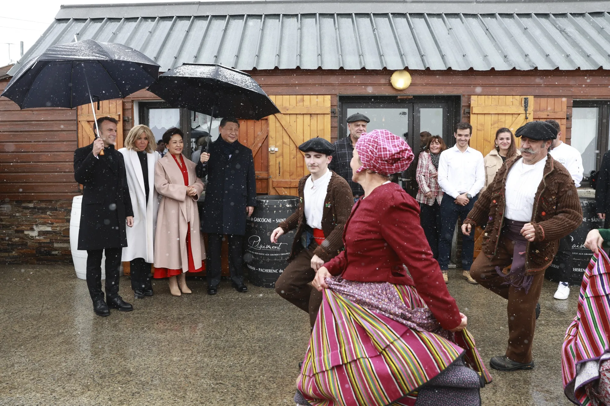 Emmanuel Macron and Xi Jinping watch folk dancers at the Tourmalet pass, in the Pyrenees, in France, on May 7.