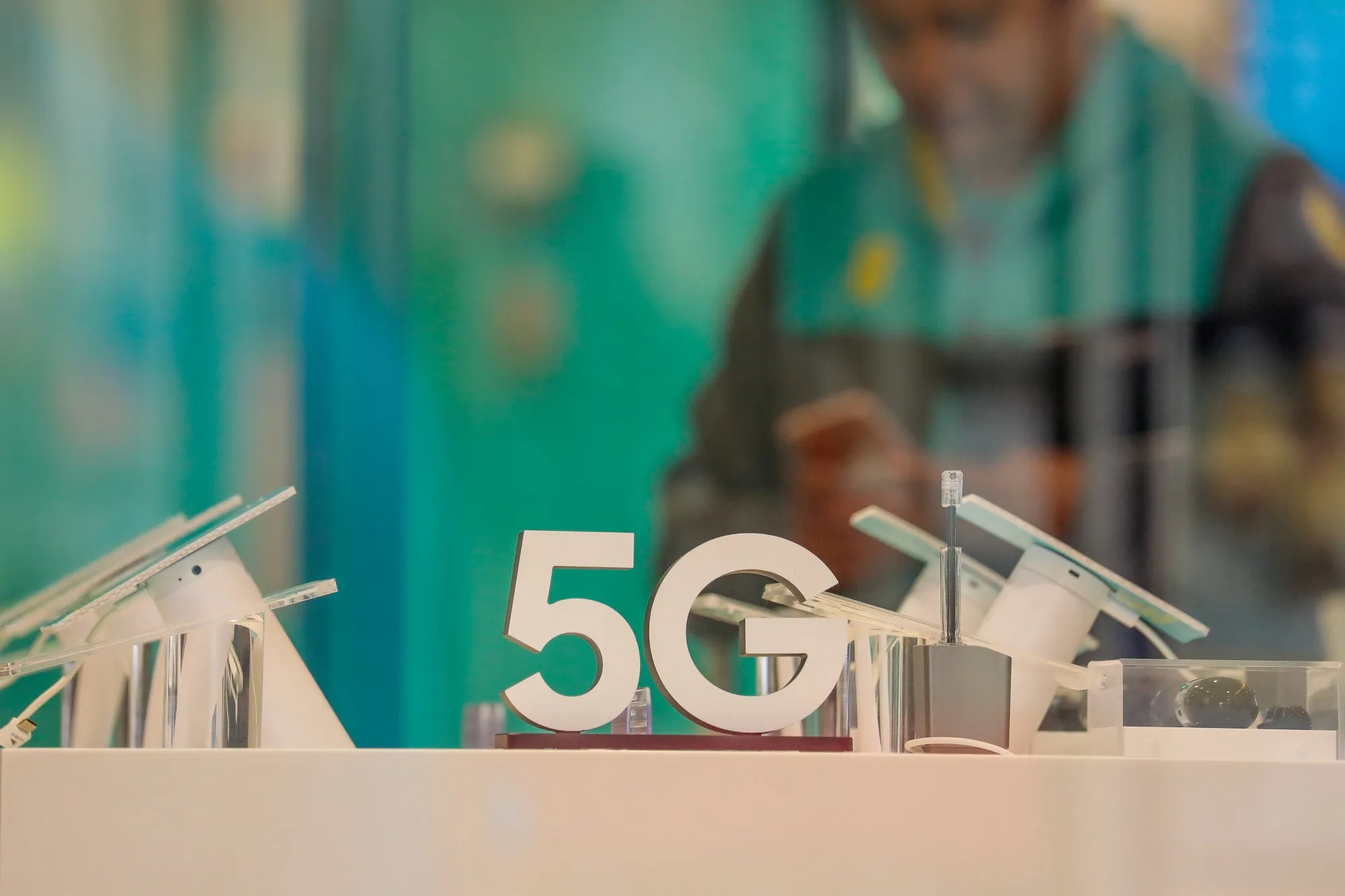 A sign advertising 5G network-enable phones sits on display inside a mobile phone store, in Reading.