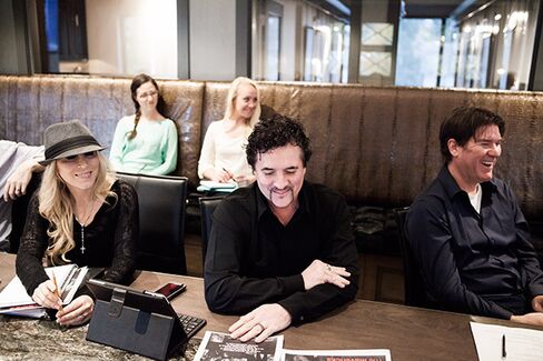 Borchetta (center) and wife, Sandi (left), in Big Machine’s Nashville office