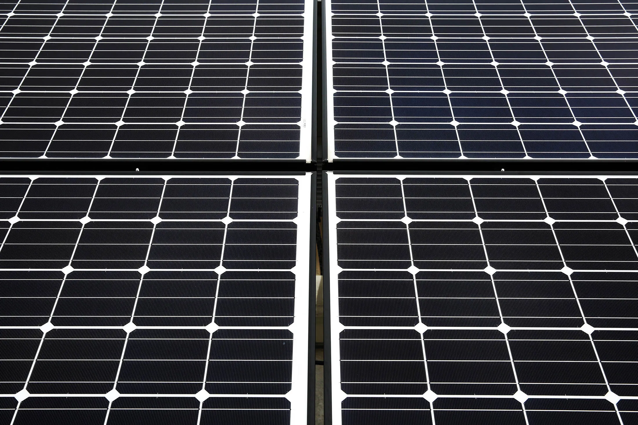 Panasonic Corp. solar panels stand at the company's Eco Solutions solar module plant in Ishiyama, Shiga Prefecture, Japan, on Thursday, July 23, 2015. Panasonic will start offering new solar panels with a 25-year warranty, longer than the warranties other Japanese panel makers currently offer.
