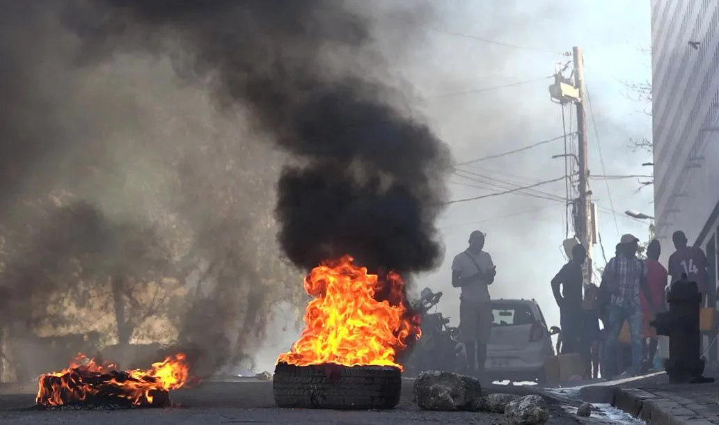 A screen grab from a video&nbsp;shows tires on fire near the main prison of Port-au-Prince, Haiti&nbsp;on March 3.