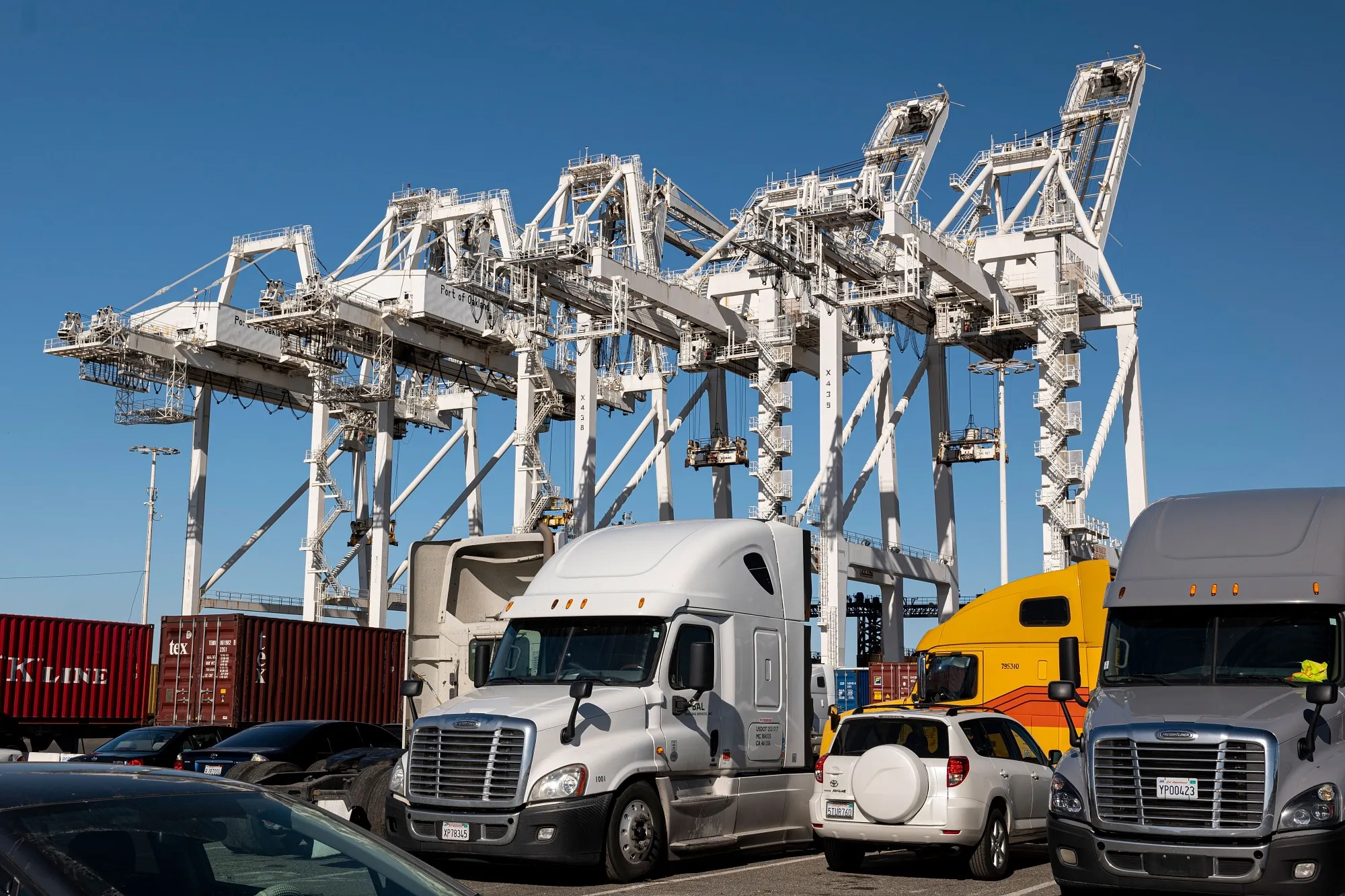 Parked trucks at the Port of Oakland. Shipping delays have led to drawdowns in inventories.