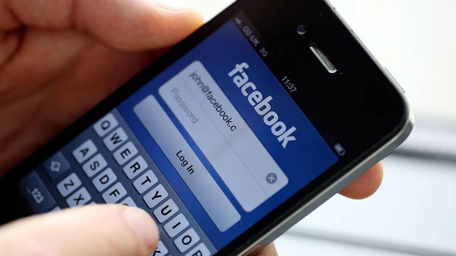 The login page for Facebook is seen on an iPhone in this arranged photograph in London on Aug. 29, 2012.
