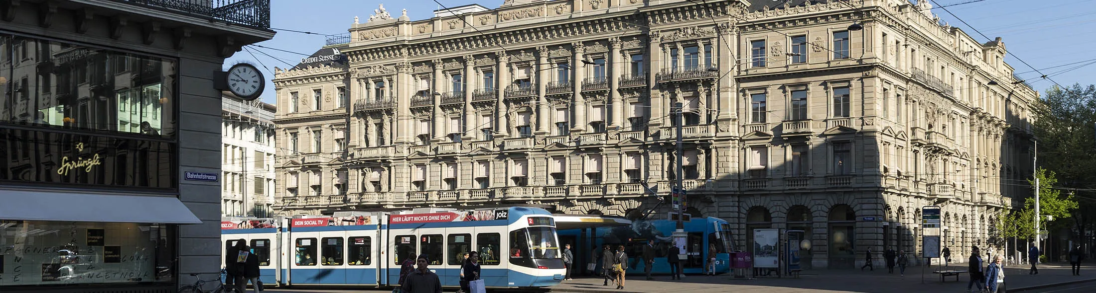 Trams sit by Credit Suisse Group AG's headquarters in Zurich, Switzerland, on Friday, April 24, 2015. Investors are betting Chief Executive Officer Brady Dougan's successor, Tidjane Thiam, 52, will downsize Switzerland's second-biggest bank more decisively to focus on money-managing businesses when he takes over in June.
