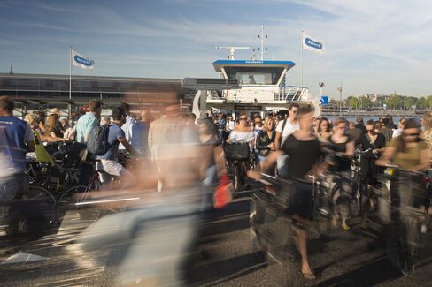 Passengers disembark from a ferry at Amsterdam Noord