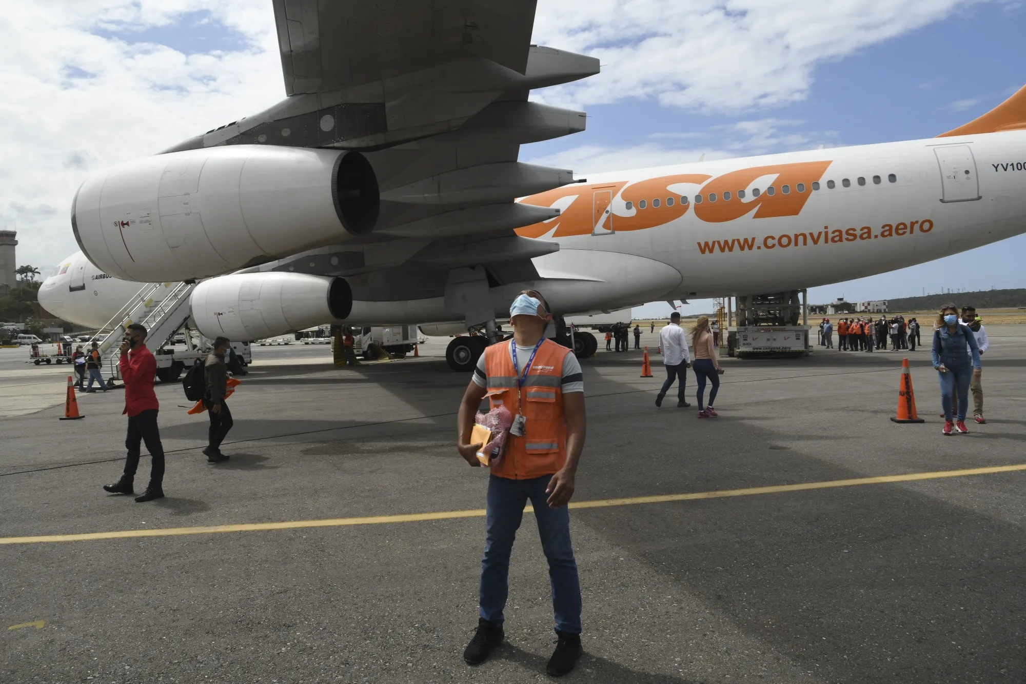 A worker inspect the Conviasa Airlines aircraft arriving with Russian Sputnik V Covid-19 vaccines at Simon Bolivar International Airport (CCS) in Maiquetia, Venezuela, on Feb. 13.