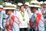 Philippine President Rodrigo Duterte reviews the honour guard at Fort Bonifacio camp in Manila on April 4.
