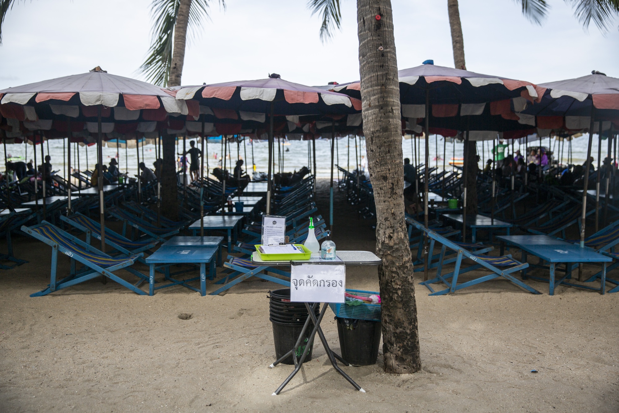 Hand sanitizer sits on a check-in table at Bangsaen Beach in Chonburi, Thailand, on June 14.