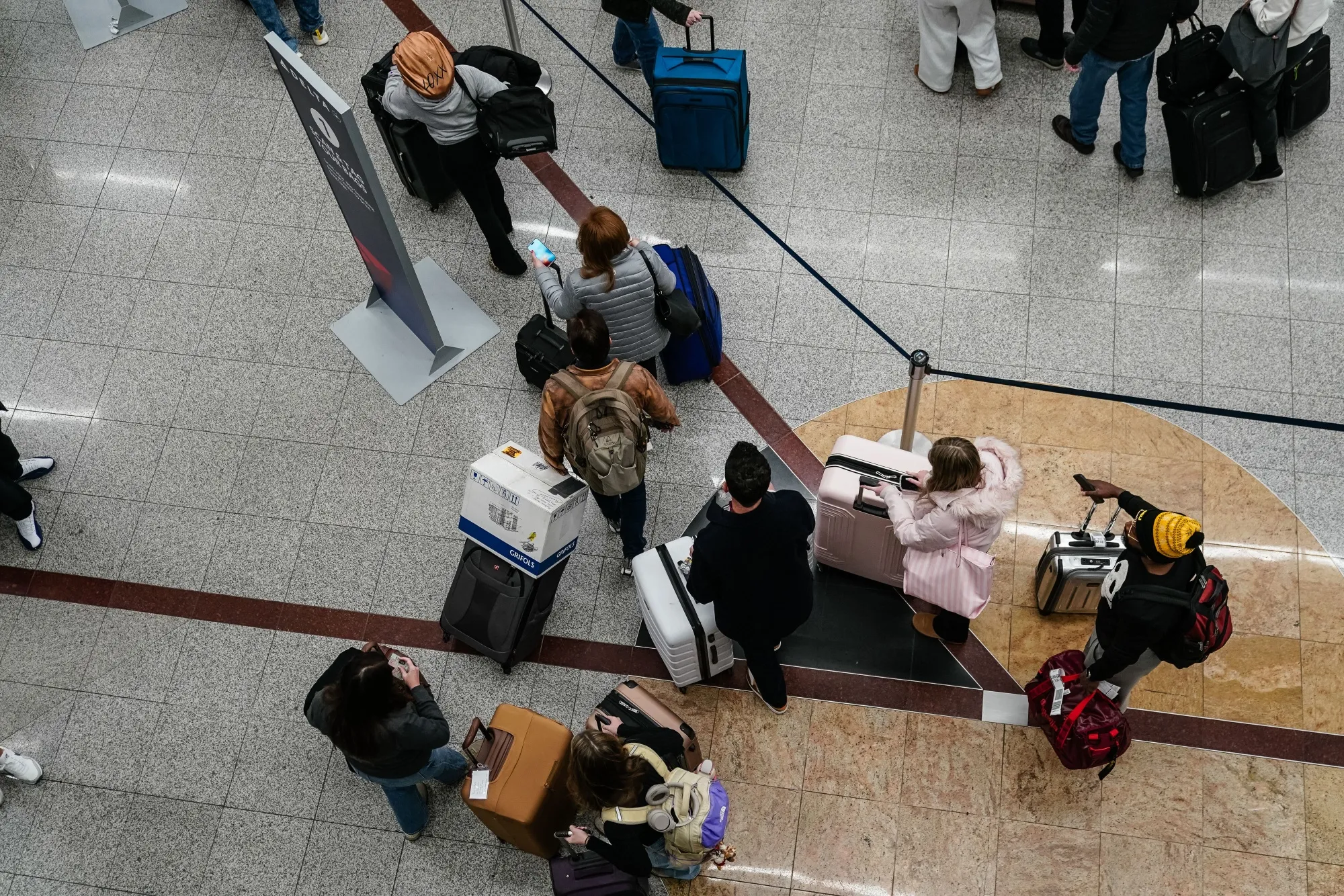 Travelers in the Delta check-in area at Hartsfield-Jackson Atlanta International Airport (ATL) in Atlanta in December 2025.