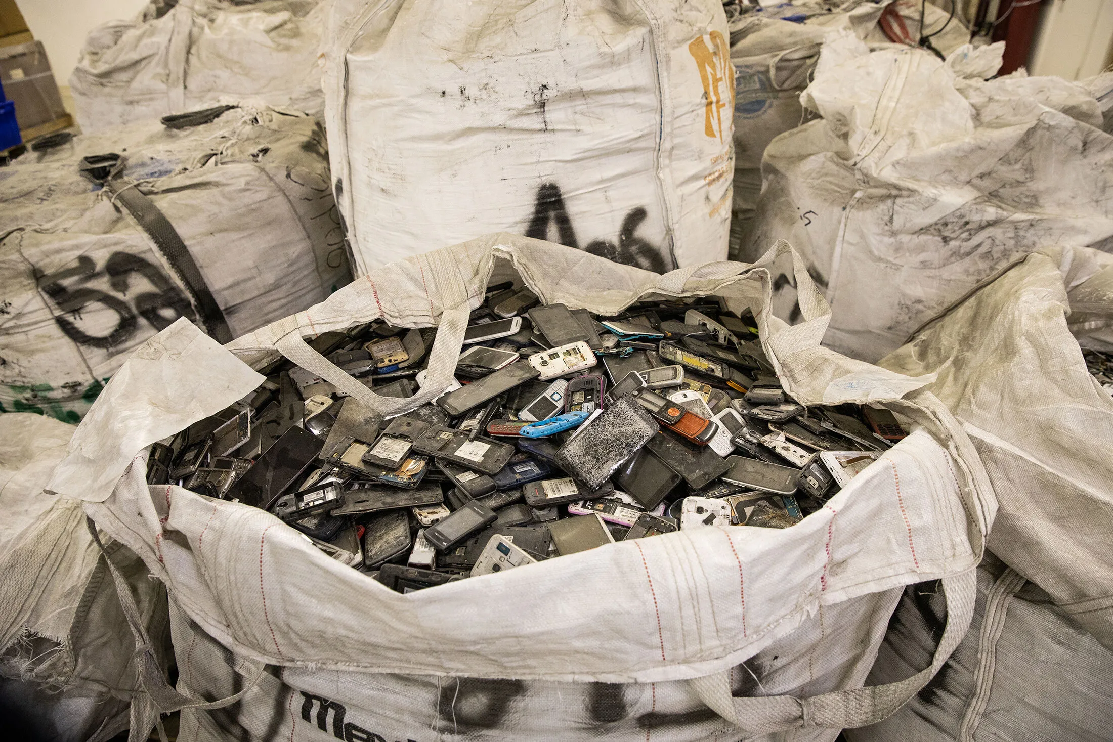 Cellphones wait to be recycled at Redwood Materials in Carson City, Nev.