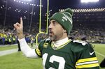 Green Bay Packers quarterback Aaron Rodgers walks off the field after an NFL football game against the Minnesota Vikings, Sunday, Jan. 1, 2023, in Green Bay, Wis. The Packers won 41-17. (AP Photo/Matt Ludtke)