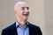 Jeff Bezos, founder and chief executive officer of Amazon Inc. and new owner of The Washington Post, leaves from the newspaper's offices after a meeting in Washington, D.C., U.S., on Wednesday, Sept. 4, 2013. Bezos agreed last month to buy the Washington Post for $250 million in a bet that he can apply his success in e-commerce to the struggling newspaper industry. Photographer: T.J. Kirkpatrick/Bloomberg via Getty Images