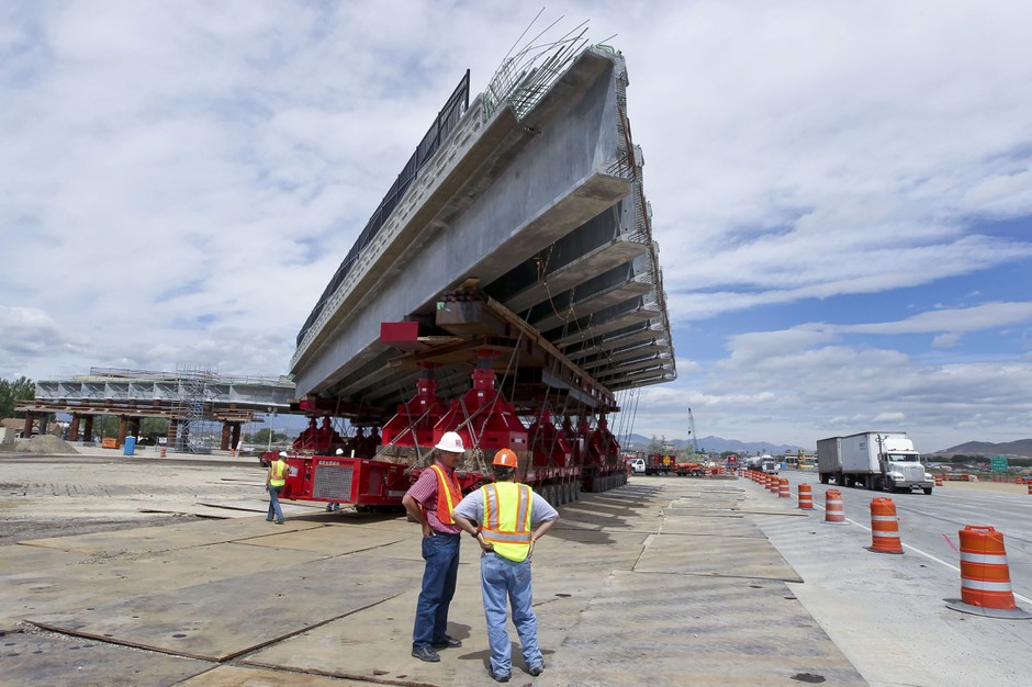 Utah Department of Transportation workers inspect a highway bridge under construction on Interstate 15 in American Fork, Utah.