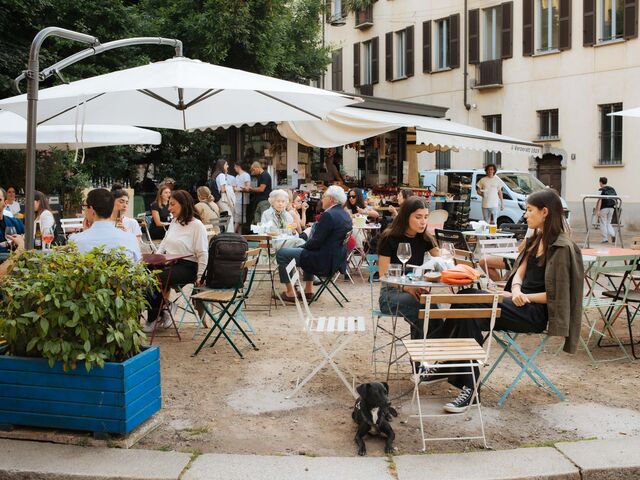 White umbrellas cover the outdoor seating around Il Verzeratt.