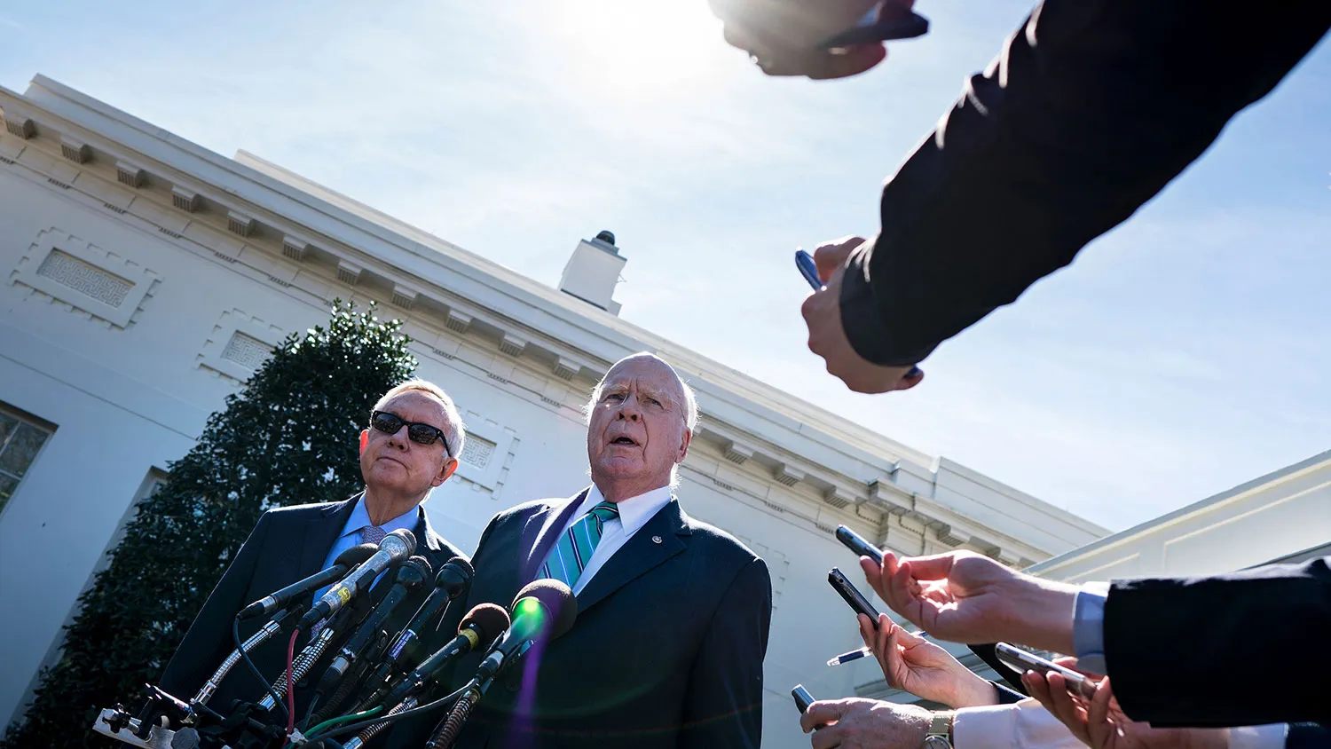 Senate Minority Leader Harry Reid (left) listens while Senate Judiciary Committee ranking member Patrick J. Leahy speaks to the press after a meeting at the White House on March 1, 2016.
