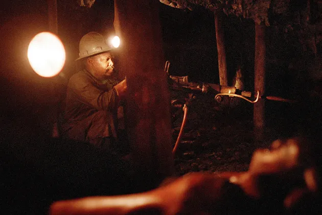 A miner digs for gold in Welkom, South Africa
