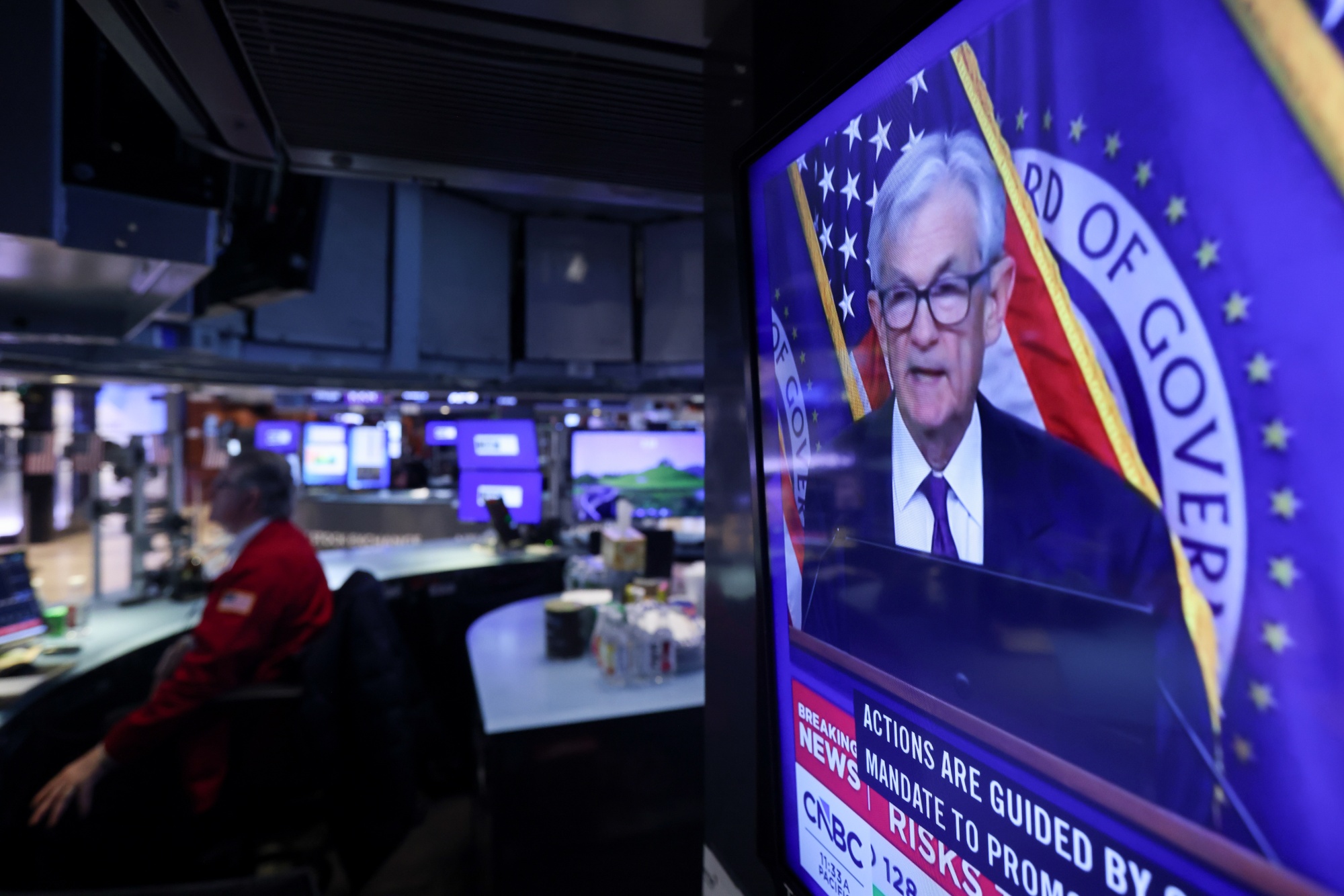 A television station broadcasts Jerome Powell after a Federal Open Market Committee meeting on the floor of the New York Stock Exchange on March 18.