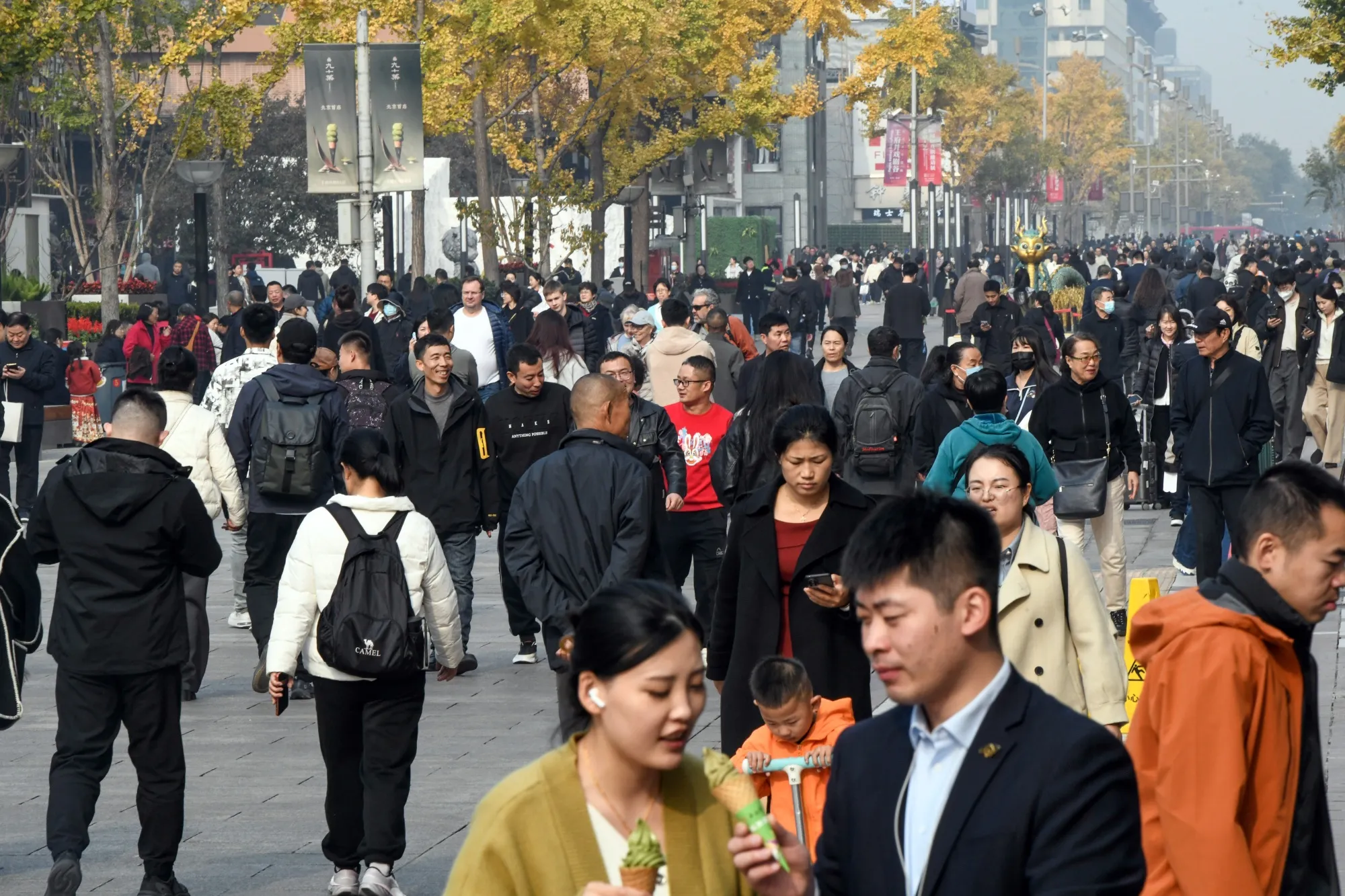 Pedestrians at the Wangfujing shopping area in Beijing.&nbsp;