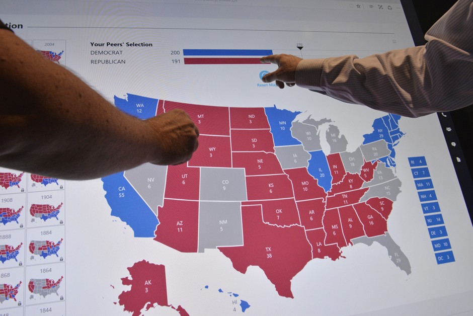 Delegates point to an electoral map at the Democratic National Convention in Philadelphia.