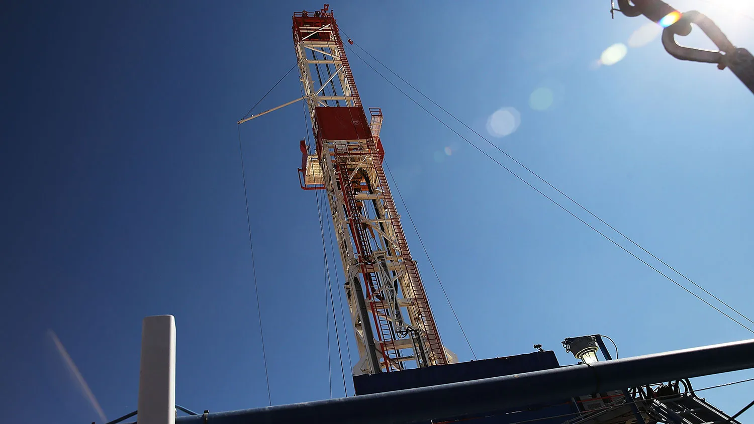 The Patterson 298 natural gas fueled drilling rig drills on land in the Permian Basin that is owned by Apache Corporation on Feb. 5, 2015, in Mentone, Texas.
