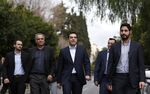 Alexis Tsipras, Greece's prime minister, center, arrives at the prime minister's residence after being sworn into office in Athens, Greece, on Monday, Jan. 26, 2015. The Independent Greeks party will support Syriza in a vote of confidence in Parliament slated for Feb. 5, Independent Greeks Party Leader Panos Kammenos told reporters after meeting with Tsipras.