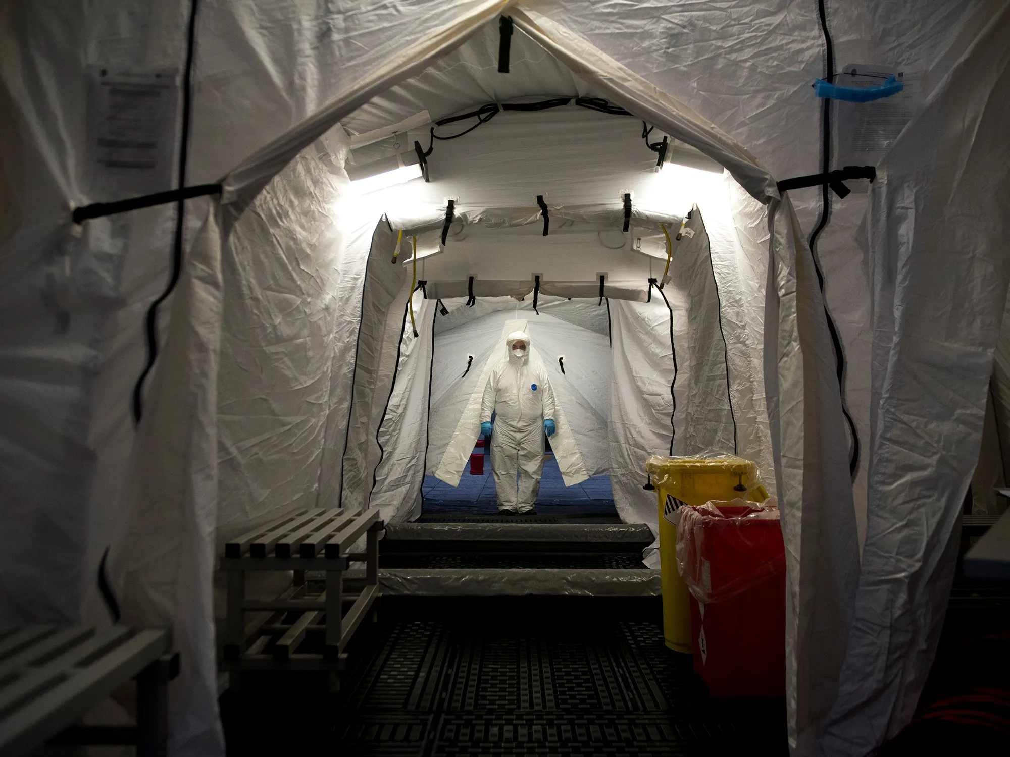 A member of Civil Protection wearing a protective suit prepares to be disinfected at the San Cecilio clinical hospital&nbsp;in&nbsp;Granada.&nbsp;