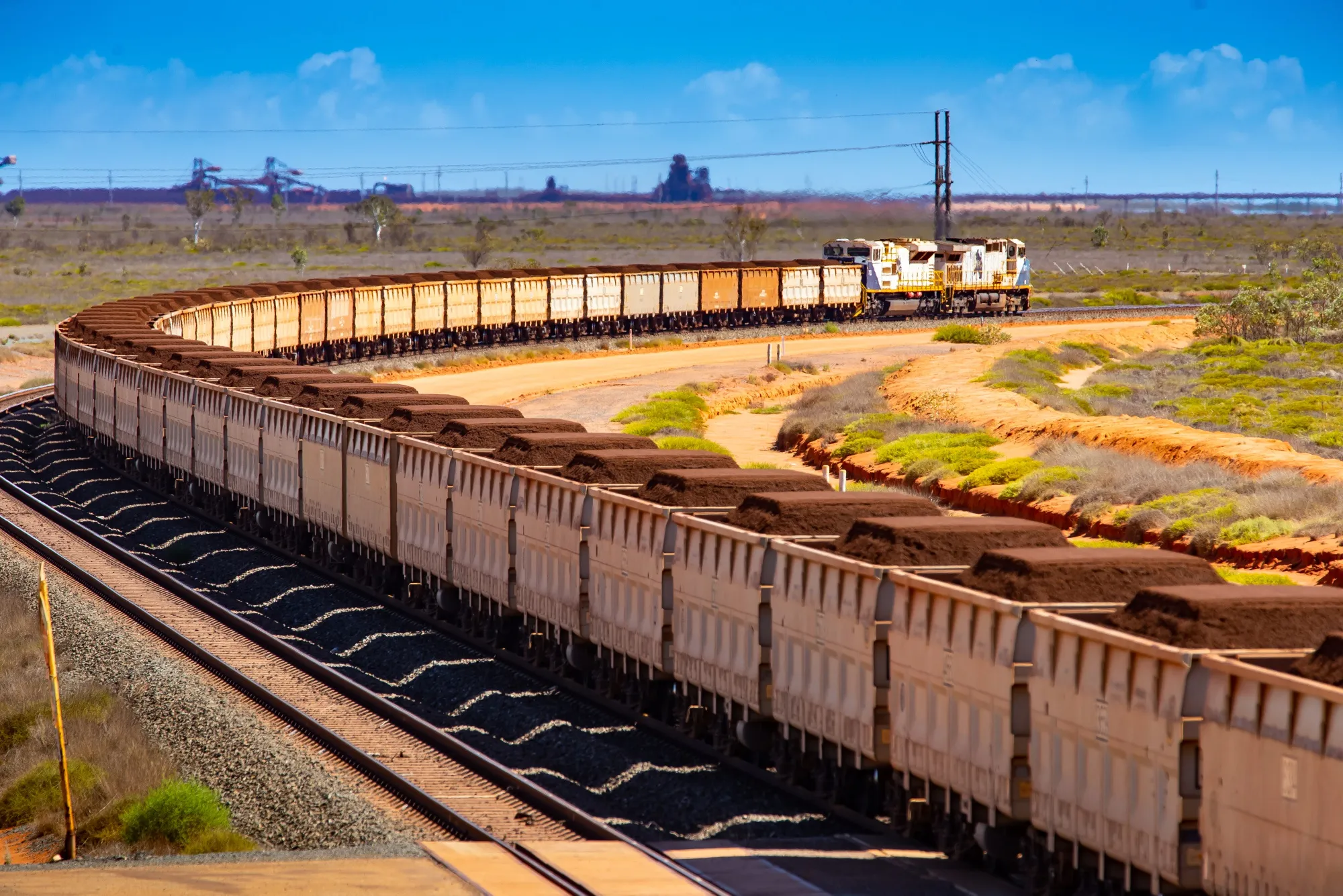A freight train carries iron ore&nbsp;towards Port Hedland, Australia.