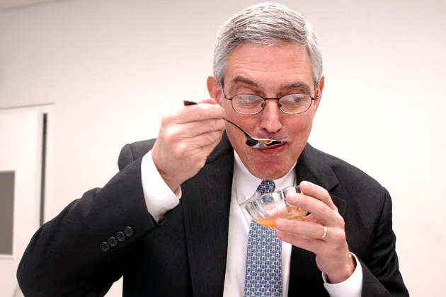 Hmm, hmm, good! Doug Conant samples some Campbell's Soup.