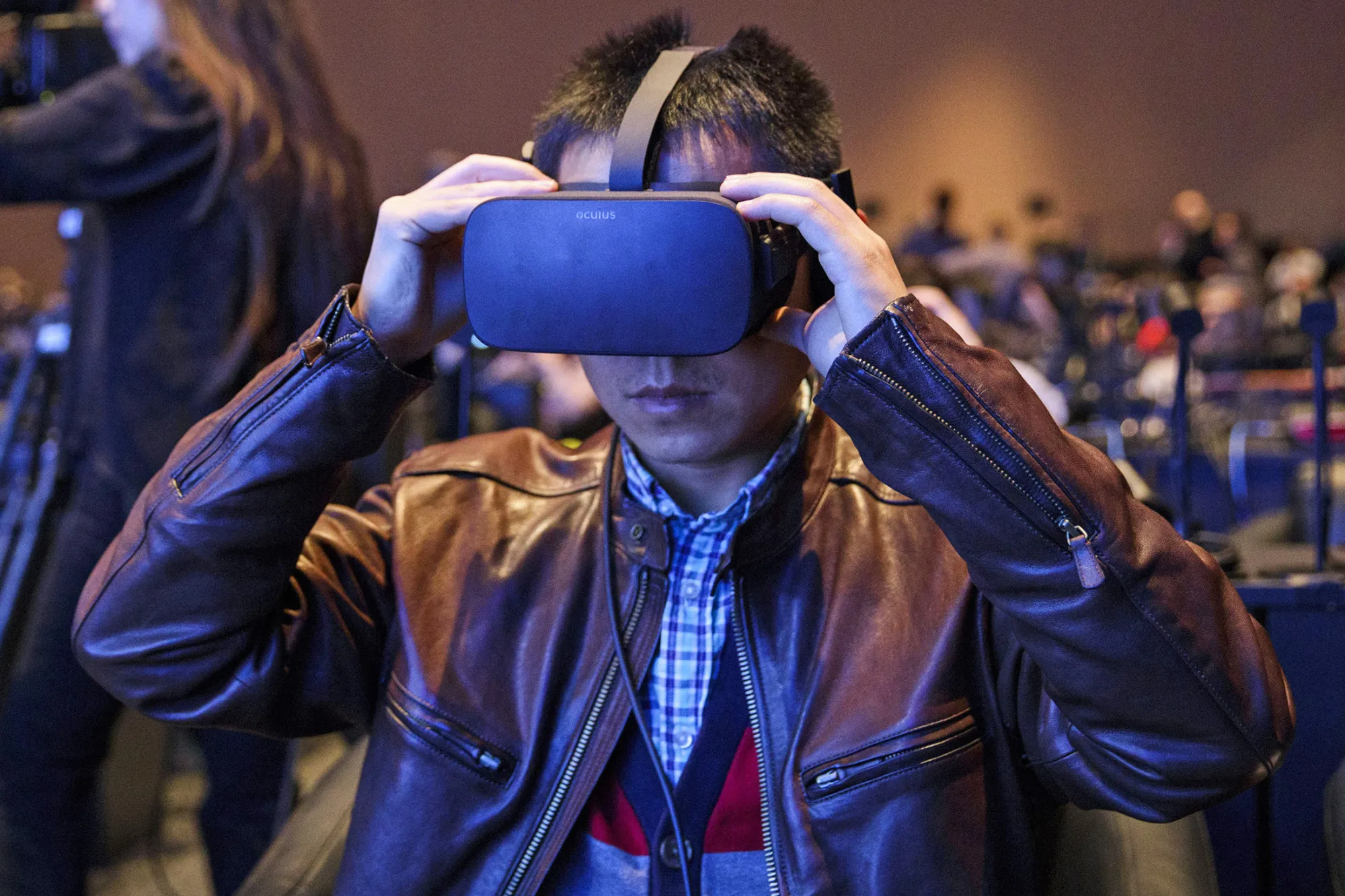 Attendees wear Oculus Rift virtual reality at CES 2017.
