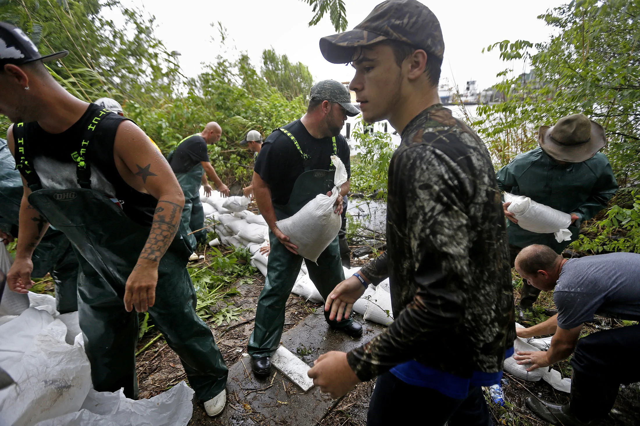 Volunteers put out sand bags due to the arrival of Tropical Storm Cindy in Lafitte, La., on June 21, 2017.

