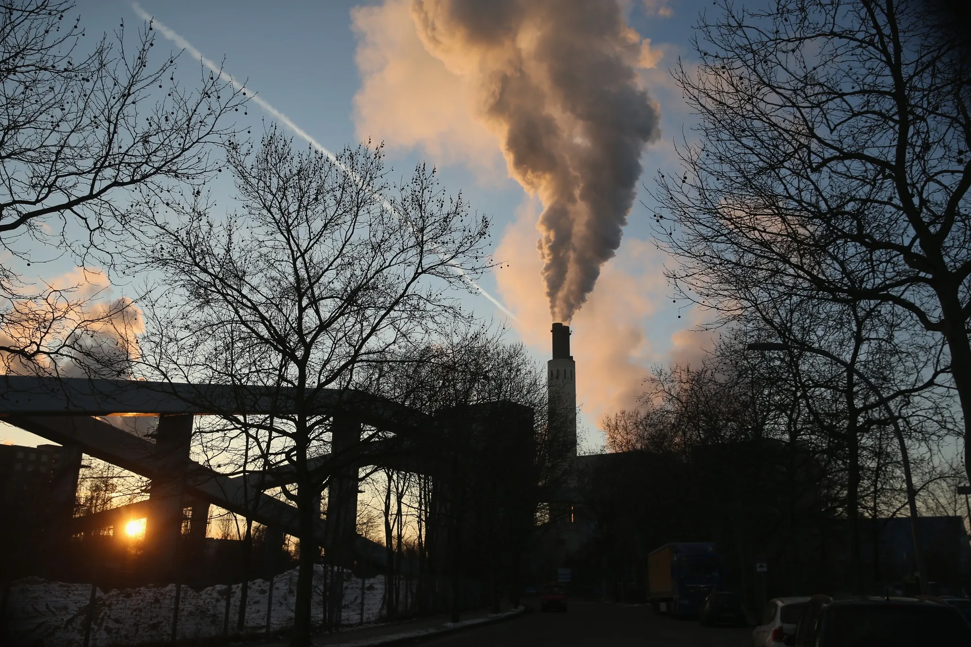 Steam and smoke rise from a coal-fired power and heating plant in Berlin.